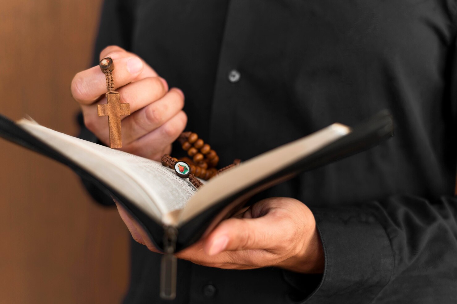 front view person holding holy book rosary 23 2148629931
